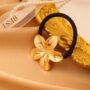 Luxe Metallic Lily Hair Tie – Golden Flower Elastic Band