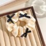 Chic Bow Scrunchie – Elegant Hair Tie with Ribbon Accents