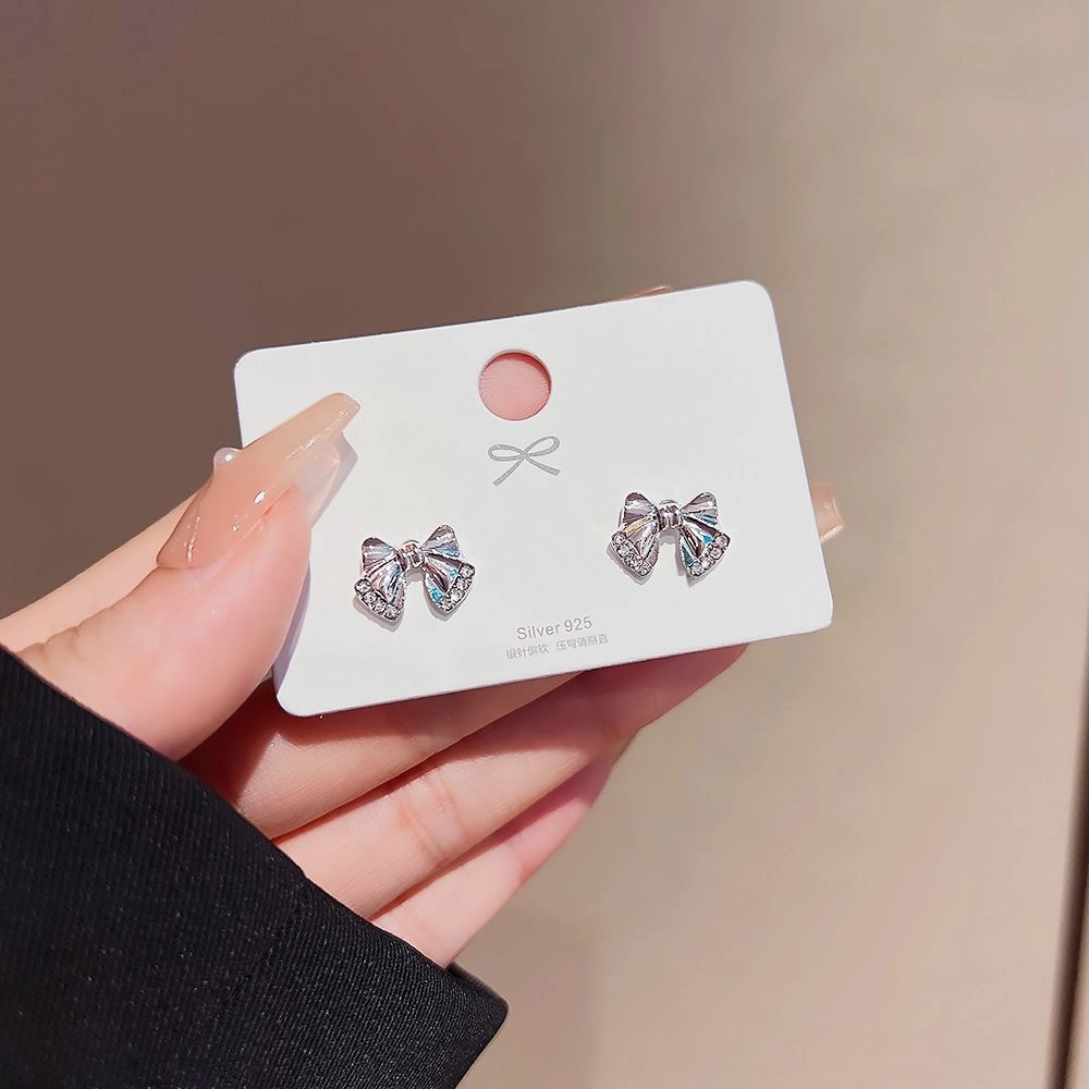 d6272d6f66ce8d4cb20d43fbd5c37e14_1732945717 π Crystal Bow Stud Earrings - Image 1