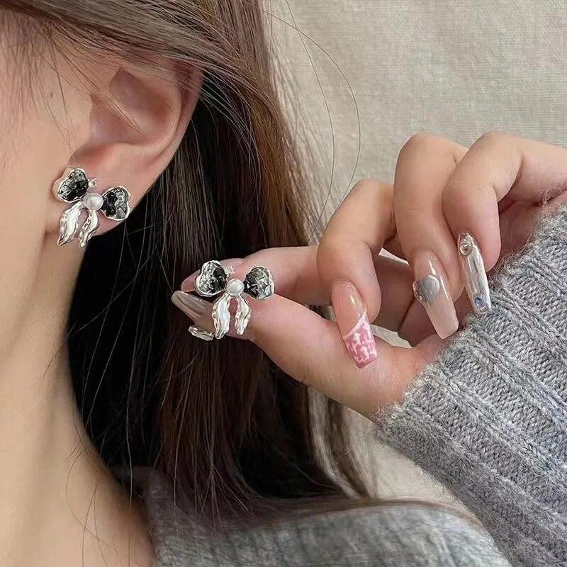 a5a7cd92a1c541cdf192e2b1ee9d97a2b4964cf4_original π€ Noir Ribbon Pearl Studs | Black Crystal Bow Earrings - Image 1